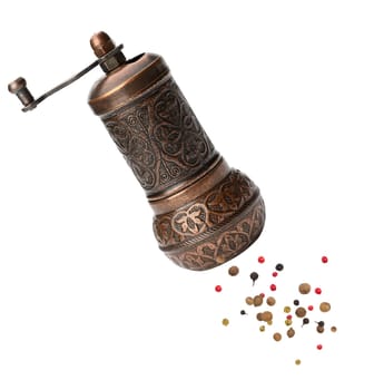 Copper hand mill for pepper and salt isolated on white background