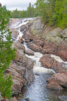 Vibrant Cascade Cutting Through a Rocky Channel on the Sand River in Superior Provincial Park in Ontario