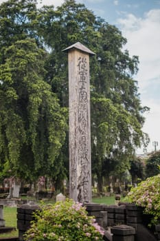 Singapore - July 9 2023: Tall Slim Japanese Tombstone Stands Tall