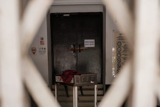 Malaysia - July 27 2023: Lobby of Abandoned Shop Through Gate