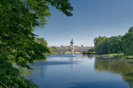 Charlottenburg Palace in Berlin seen from a public footpath by the carp pond