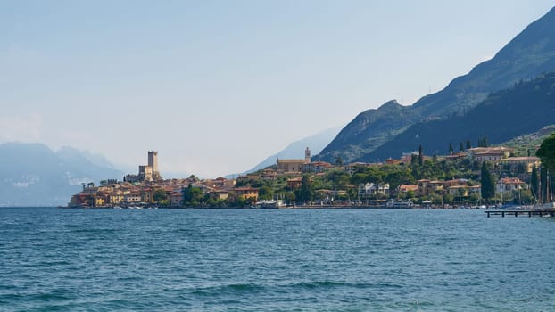 Panoramic view of the medieval town of Malcesine on Lake Garda in Italy seen from the water