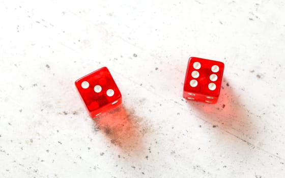 Two red craps dices showing Centerfield Nine - Nina (Number 3 and 6) overhead shot on white board