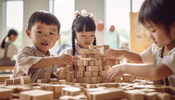 Asian kindergarten. Children boy and girl playing with constructor wooden block building, Happy little kids play wood block stacking, activities learning creative, toys for preschool and kindergarten Chinese