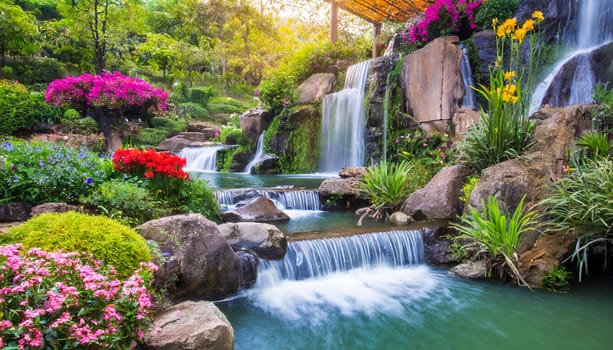 Waterfall in the garden with sunlight, beautiful nature landscape background. AI generated