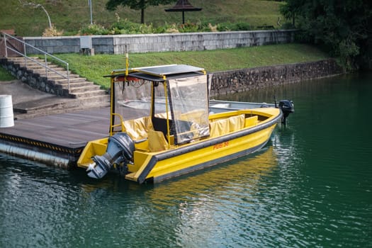 Singapore - September 7 2023: Yellow Patrol Boat at Platform