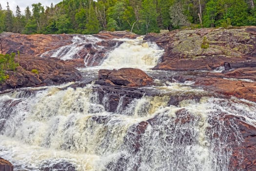Wild River Tumbling Across Ancient Rocks on the Sand River in Superior Provincial Park in Ontario