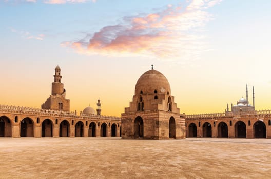 Minaret and ablution fountain of the Ibn Tulun Mosque, sunset view of a famous place of Cairo, Egypt.