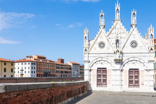 Pisa, Italy - 29 June 2023: colourful buildings on Arno river. Urban skyline, travel destination.