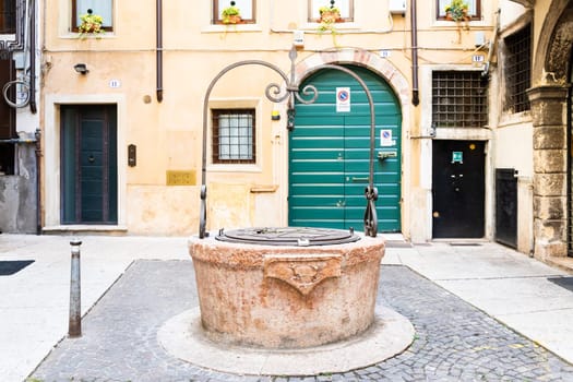 Verona, Italy - July 2022: the famous Well of Love, romantic sightseeing in the heart of the city