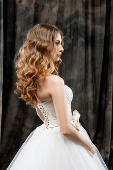 Portrait of beautiful woman with long wavy hair in profile