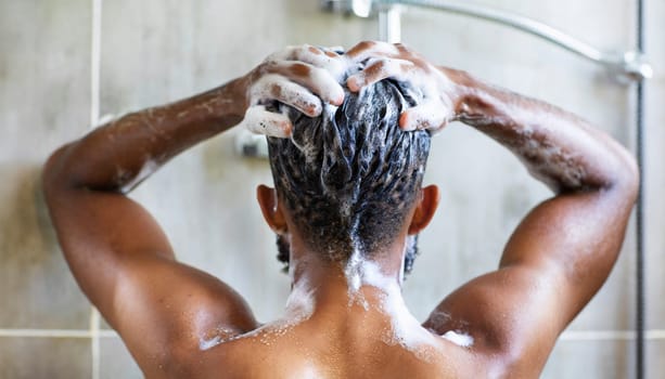Man washing his hair in the shower, close-up, rear view. AI generated