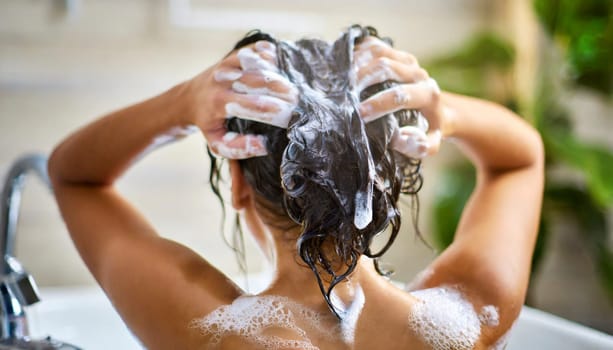 Woman washing his hair in the shower, close-up, rear view. AI generated