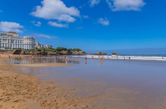 Biarritz, France, July 03, 2023: People at the beach Grande Plage (Big beach) in the French resort town of Biarritz.