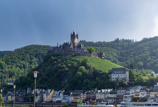 Cochem, Germany, August 10, 2023. Beautiful view of the hilltop castle (Reichsburg Cochem) in the touristic town of Cochem on the Moselle River in Rhineland-Palatinate in Germany.