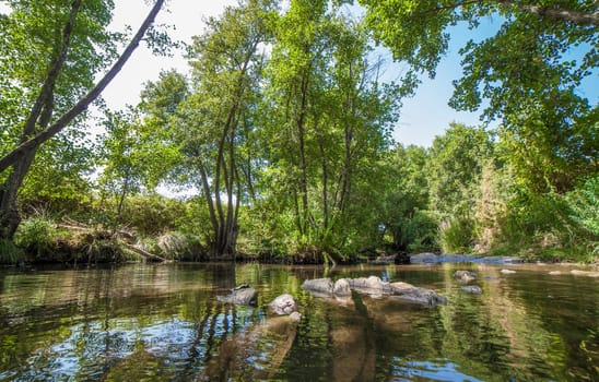 Gevora rocky riverbed, La Codosera, Badajoz, Extremadura, Spain. Idyllic location of crystal clear waters and riverside forests