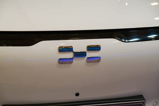 Lisbon, Portugal - May 12, 2023: Aiways electric car logo emblem close up