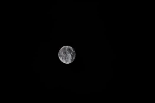 Full moon, composite image from several photos. The moon with crater and mountains.