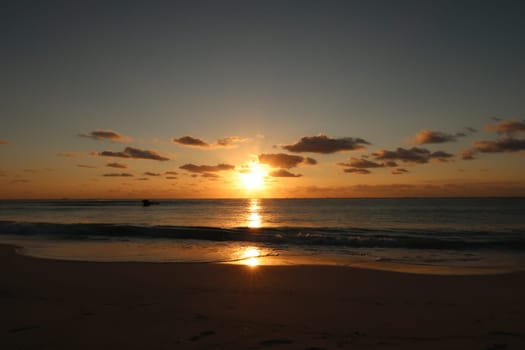 Sunrise and its reflection at the beach in playa del Carmen, Mexico 2022