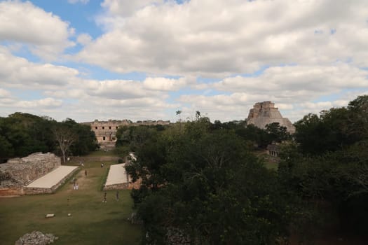 View on the Ball Game/Juego de Pelota and the Pyramid of the Magician/Piramide del Advino at Uxmal from a distance, Merida, Mexico 2022