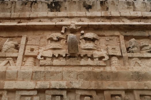 Elaborate facade of the Nunnery Complex, the Nuns house, showing mayan mask face, Chichen Itza, Valladolid, Mexico 2022