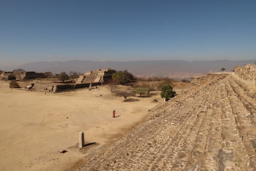 The stairs of the North Platform and the ruins of the West Group next to it at the archaeological Site of Monte Alban, Oaxaca, Mexico 2022
