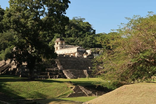 Catching a glimpse of the Palace/El Palacio and its tower at the archaeological site of Palenque, Mexico 2022