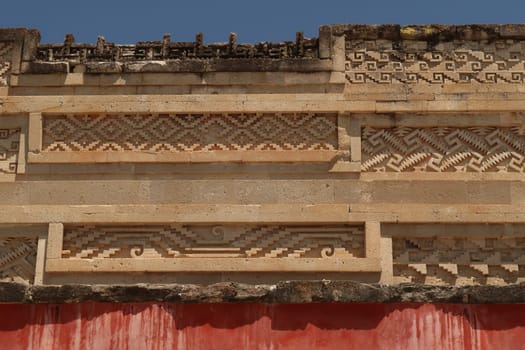 Different shapes, carvings, patterns and red colored wall on the southern facade of The Palace/Grand Hall of Columns, Mitla, Oaxaca, Mexico 2022