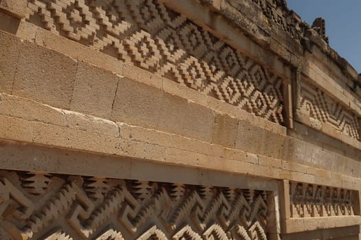 Many patterns and shapes on one of the outer walls of The Palace/Grand Hall of Columns, at the archaeological site of Mitla, Oaxaca, Mexico 2022