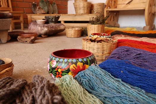 Display of natural ingredients that are needed to dye the threads for a traditional mexican carpet, Oaxaca, Mexico 2022