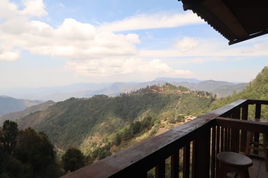 View from a wooden balcony onto the hilly landscape of San Jose del Pacifico, Oaxaca, Mexico 2022
