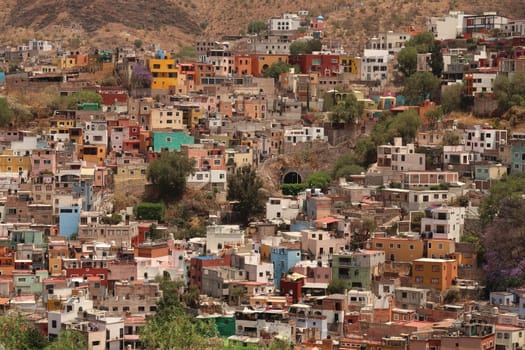 View onto a neighbourhood in Guanajuato with its colorful houses and an entrance to its famous tunnel system, Mexico 2022