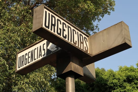 Sign marking the emergency area of a hospital, Urgencias translates to Emergencies, Puebla, Mexico 2022