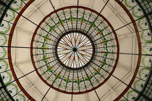 The colorful glass roof/copola of the Quiosco de la rosa de los vientos in the La Victoria Market, Mercado de La Victoria, Puebla, Mexico 2022