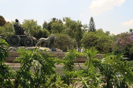 The statue on the Fountain of Cybele/Fuente de Cibeles, replica of a famous fountain in Madrid, located on a traffic circle in Mexico City 2022