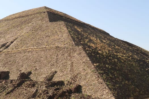 The dry grass is growing on the surface of the giant Pyramid of the Sun at Teotihuacan, Mexico City 2022