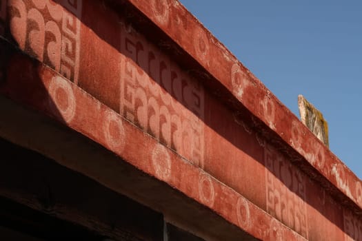 Red painted elements with patterns/symbols in the Quetzalpapálotl Palace/Palacio de Quetzalpapálotl at Teotihuacan, Mexico City 2022