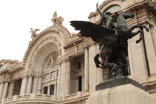 The balcony on the facade of the Palacio de Bellas artes/the Palace of fine arts and one of the Pegasus Statues next to it, Mexico City 2022
