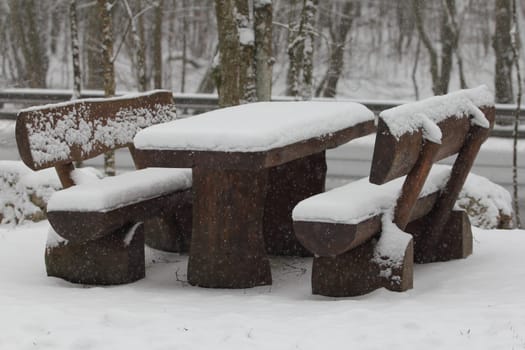 A resting place for hikers covered with fresh snow