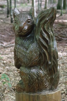 A squirrel carved from a tree trunk, mammal