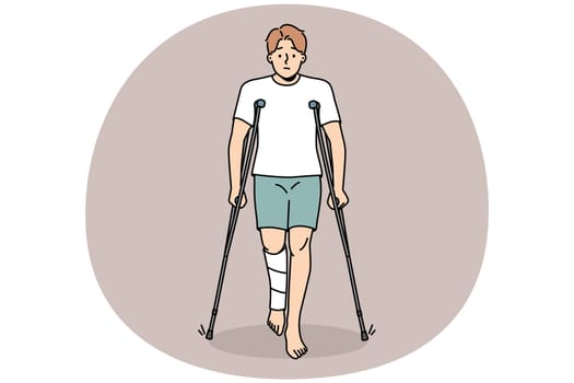 Unhappy young man with leg injury walking on crutches. Upset injured male with limb trauma suffer walking or standing. Healthcare and recovery. Vector illustration.