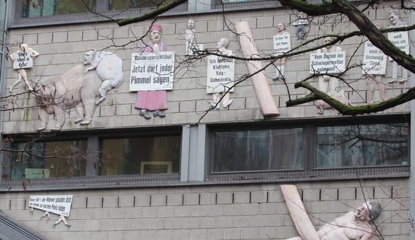 Berlin,Germany 1. April 2018: The relief sculpture Friede sei mit Dir, also known as the cock of Berlin is an artwork by sculptor Peter Lenk. It is located in Berlin at the building of the editorial staff of German newspaper taz.