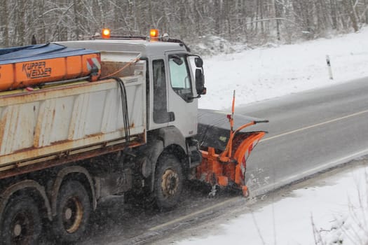 Birkenfeld, Germany February 6, 2018: A Winter service vehicle in use in heavy snow-fall