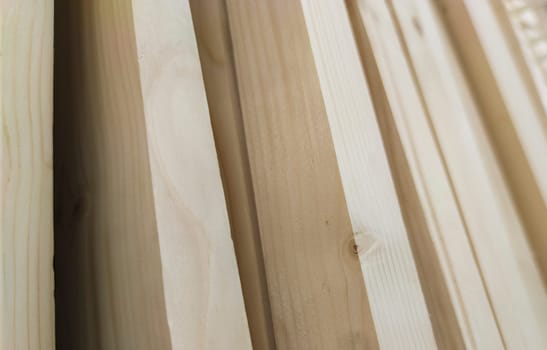 Planed strips made of fir tree wood. Selective focus