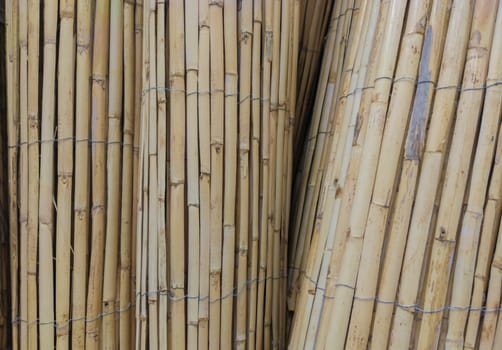 Garden fence rolls built with wattle. Selective focus