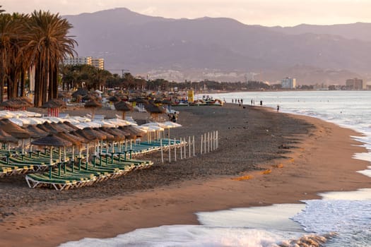 View of Bajondillo Beach in Torremolinos at sunrise. Costa del Sol, Spain.