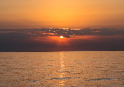 Sunrise over the Mediterranean Sea seen from the beach in Torremolinos. Costa del Sol, Spain