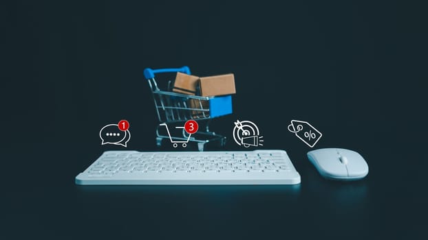 Boxes in a shopping car and keyboard on dark background. Ideas about online shopping, Online shopping for electronic commerce, Allows consumers to directly buy goods from seller over the internet.