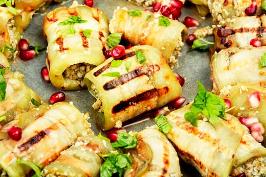 Grilled Georgian eggplant rolls with walnut and meat filling, badrijani.
