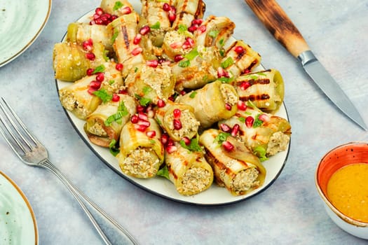 Badrijani, Vegan vegetarian healthy food. Grilled eggplant rolls on the table.